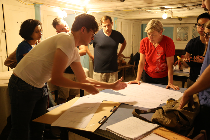 Graduate students in Prof. Traynor's class discuss the completion of the ship survey. 