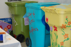 Students painted donated garbage totes as a colorful solution to litter in the community.