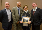 Ibrahim Jammal, founder of UB's urban planning program, was posthumously recognized by ACSP's Global Planning Educators Interest Group for his impact on international planning education. His wife Viviane Jammal (second from right) accepted the award. Standing with Jammal are (from left to right), Daniel Hess, Alfred Price, and Dean Robert Shibley. Photo by Maryanne Schultz