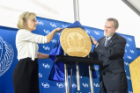 Dean Robert Shibley and Valerie Christianson of Bergmann Associates unveil a plaque celebrating Hayes Hall's achievements in sustainable design. The building is on track for LEED Gold Certification by the U.S. Green Building Association.