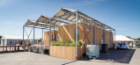 The GRoW Home's signature steel canopy braces 24 Silevo PV panels and a solar water heating system while providing shading for the entire home. It also serves as infrastructure for climbing plants and, eventually, a green wall and roof. Photo: Carl Burdick