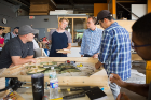 Team Walter P. Moore huddles in a prototyping session in the fabrication shop in Parker Hall. Photo by Douglas Levere