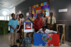 Beaming participants in the Center for Urban Studies Summer Academic Camp on Neighborhood Development stand with their final projects, presented to the public at the end of the program.
